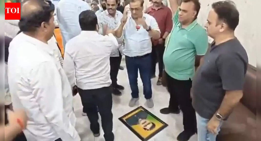 BJP issues show-cause notice to party worker after photo of former corporator who left party was blackened | Thane News