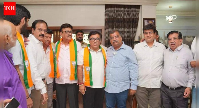 Boost for BJP in Ulhasnagar as former Congress corporator Godhumal Krishnani, son join party | Thane News