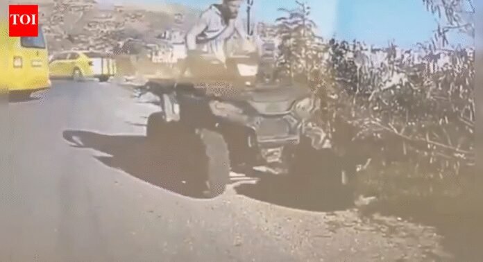 Video: Israeli settler drives ATV into Palestinian kneeling for prayer; IDF confiscates weapon