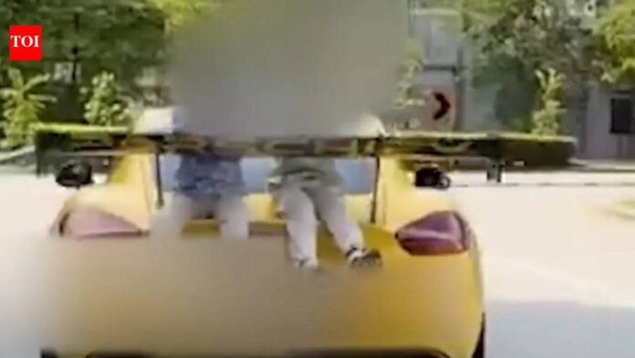 Indian-origin man charged in Singapore for driving car with children on rear boot