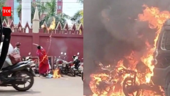 Watch: Woman sets SUV, two-wheelers ablaze using 'petrol bombs' at Orissa high court, tells shopkeeper to film act | Bhubaneswar News